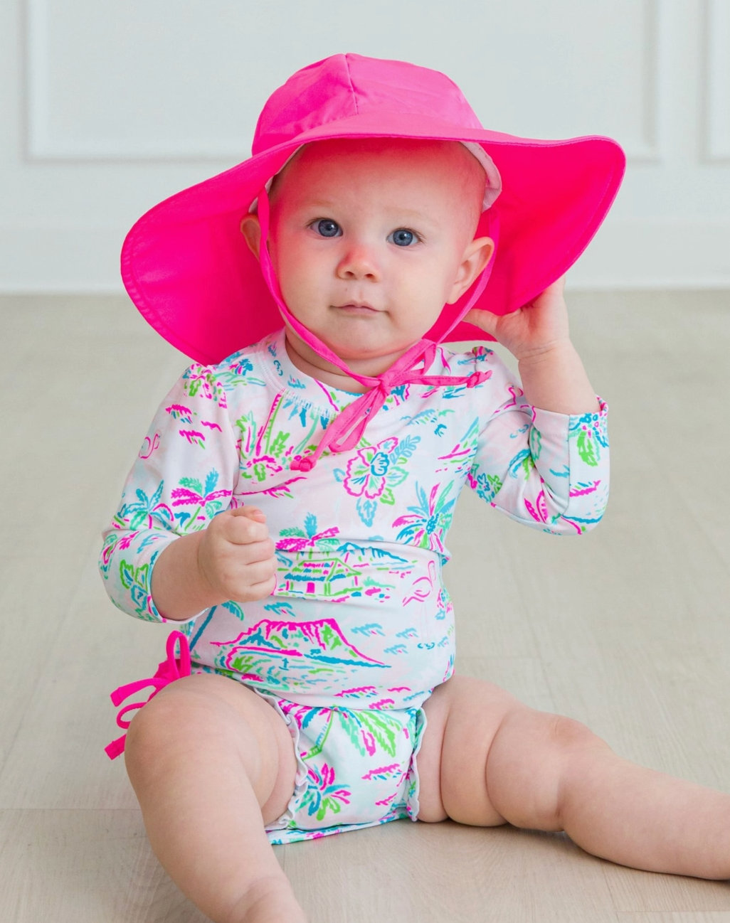 Rufflebutts Baby + Toddler Neon Magenta Sun Protective Hat